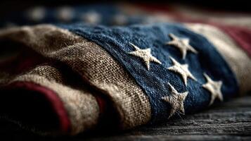 Folded American flag resting on a rustic wooden surface showcasing its rich colors and textures under soft lighting photo