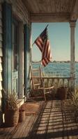 Rustic porch with American flag overlooking calm waters during early morning hours photo