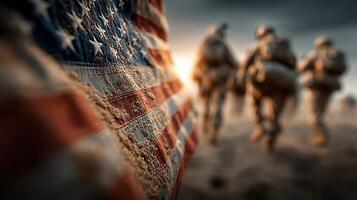 Soldiers march toward a distant horizon with an American flag in the foreground at sunset photo