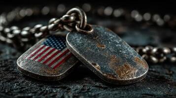 Vintage military dog tags featuring American flag design resting on a textured surface photo