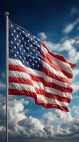 American flag waving under a bright blue sky with fluffy clouds during midday photo