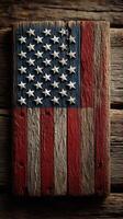Rustic wooden representation of the American flag displayed on weathered wood planks in natural light photo