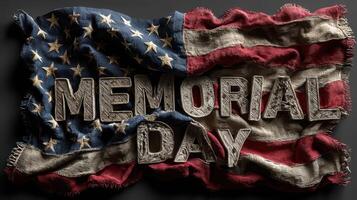 Worn American flag with textured lettering for Memorial Day celebration in a dark setting photo