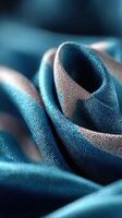 Delicate blue and silver fabric elegantly arranged in a swirling pattern showcasing texture and color contrast photo