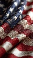 Colors of patriotism on a textured American flag in close-up view highlighting fabric details and folds photo