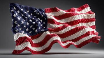 USA flag waving dynamically in front of a dark background displaying its colors and texture during an indoor setting photo