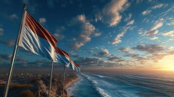 Waves crash against the shore as colorful flags flutter in the vibrant sunset sky by the coastline photo