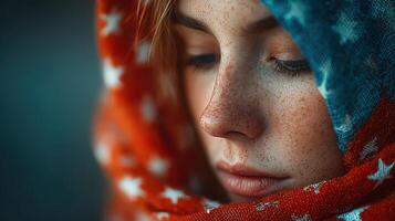 Young woman wearing a colorful scarf with stars in a close-up portrait during twilight photo