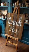 Handcrafted thank you sign on an easel displayed in a cozy art studio with colorful supplies photo