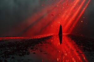 Dark figure stands amidst glowing red light and scattered petals in a surreal landscape during twilight photo