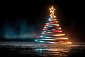 Illuminated Christmas tree with colorful lights shining in a dark setting during the festive season photo