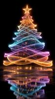 Colorful light trails create a glowing Christmas tree in a dark setting during the holiday season photo
