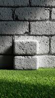 Textured gray concrete blocks against vibrant green artificial grass in a modern setting photo