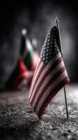 Flag displayed prominently on a textured surface with soft background lighting highlighting additional flags photo