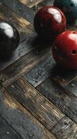 Bowling balls on a rustic wooden floor in a modern bowling alley at evening time photo