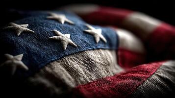 American flag draped with texture showcasing fabric details in low light setting during patriotic celebration photo