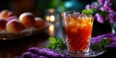 Refreshing iced tea with mint and peaches served at a cozy gathering in a dimly lit setting photo