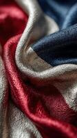Beautifully draped fabric showcasing rich textures in red, white, and blue colors, ideal for a decorative setting or artistic project photo