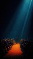 Spotlight on a speaker in an empty theater during a dramatic presentation photo
