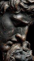 Sculptural detail of a bronze statue showcasing intricate facial features and textures in a dark setting photo