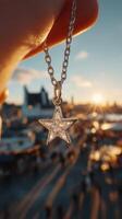 Beautiful silver star pendant captured against a golden sunset in a bustling outdoor market photo