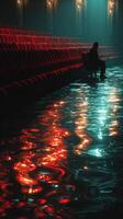 Reflections of solitude in a flooded theater with vibrant colors at dusk photo
