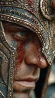 Detail of a warrior's face with a decorative helmet and war paint during a historical reenactment event photo