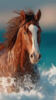 Horse running through ocean waves with mane flowing rapidly in bright sunlight photo