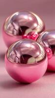Modern decorative spheres showcasing reflective pink surfaces arranged artistically on a soft background photo