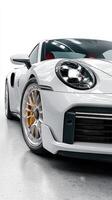 Sleek custom sports car showcased in bright studio environment with polished wheels and intricate design details photo