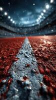 Close-up view of a rain-soaked running track in a stadium during a cloudy afternoon photo