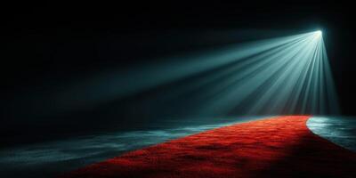 Spotlight shines on a red carpet in a darkened space preparing for a special event photo