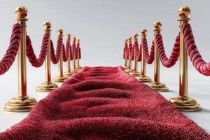 Elegant red carpet entrance with golden stanchions and velvet ropes at a prestigious venue in a well-lit setting photo