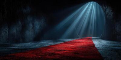 Bright beams of light shine through an archway onto a red carpet in a dimly lit cavern photo