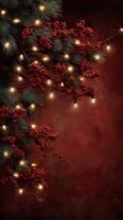 Holiday decorations with red berries and string lights against a dark background photo