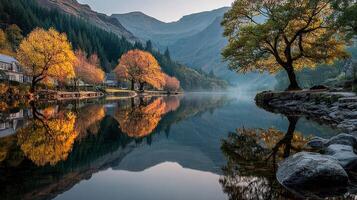 Tranquil autumn reflection in serene lake surrounded by mountains at dawn photo