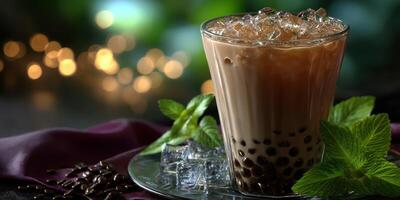 Beverage with tapioca pearls served in a glass filled with ice and mint leaves during a cozy evening gathering photo
