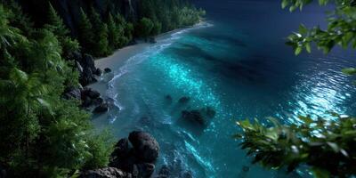 Calm shoreline with glowing water at night surrounded by lush greenery and rocky formations photo