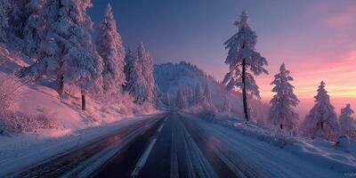 Winter sunrise illuminates snowy road through pine trees in a serene mountain landscape photo
