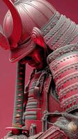 Samurai warrior in intricate armor posing against a vivid red background photo