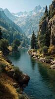 Serene river flowing through a lush valley with mountains in the background during clear daylight photo