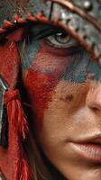 Warrior adorned in vivid face paint, showcasing fierce expression and detailed tribal attire during a cultural event at sunset photo