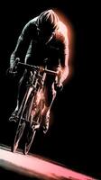 Cyclist racing at night with illuminated path, showcasing speed and determination in a competitive environment photo