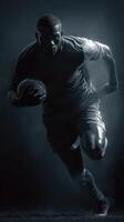 Intense football player sprinting with ball during training session at dusk photo