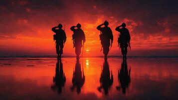 Soldiers saluting at sunset on a beach during a military ceremony photo