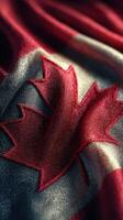 Canada flag close-up showcasing intricate details of the maple leaf design on fabric photo