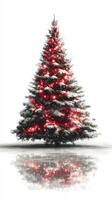 Festive winter scene with a beautifully lit Christmas tree covered in snow photo