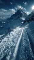 Snowy mountain landscape with a winding path under a bright sky in winter photo