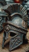 Historic Roman helmet displayed on rustic wooden surface in bright light with details highlighting craftsmanship photo