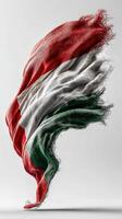 Hungarian flag waving gracefully in a studio setting with soft lighting photo